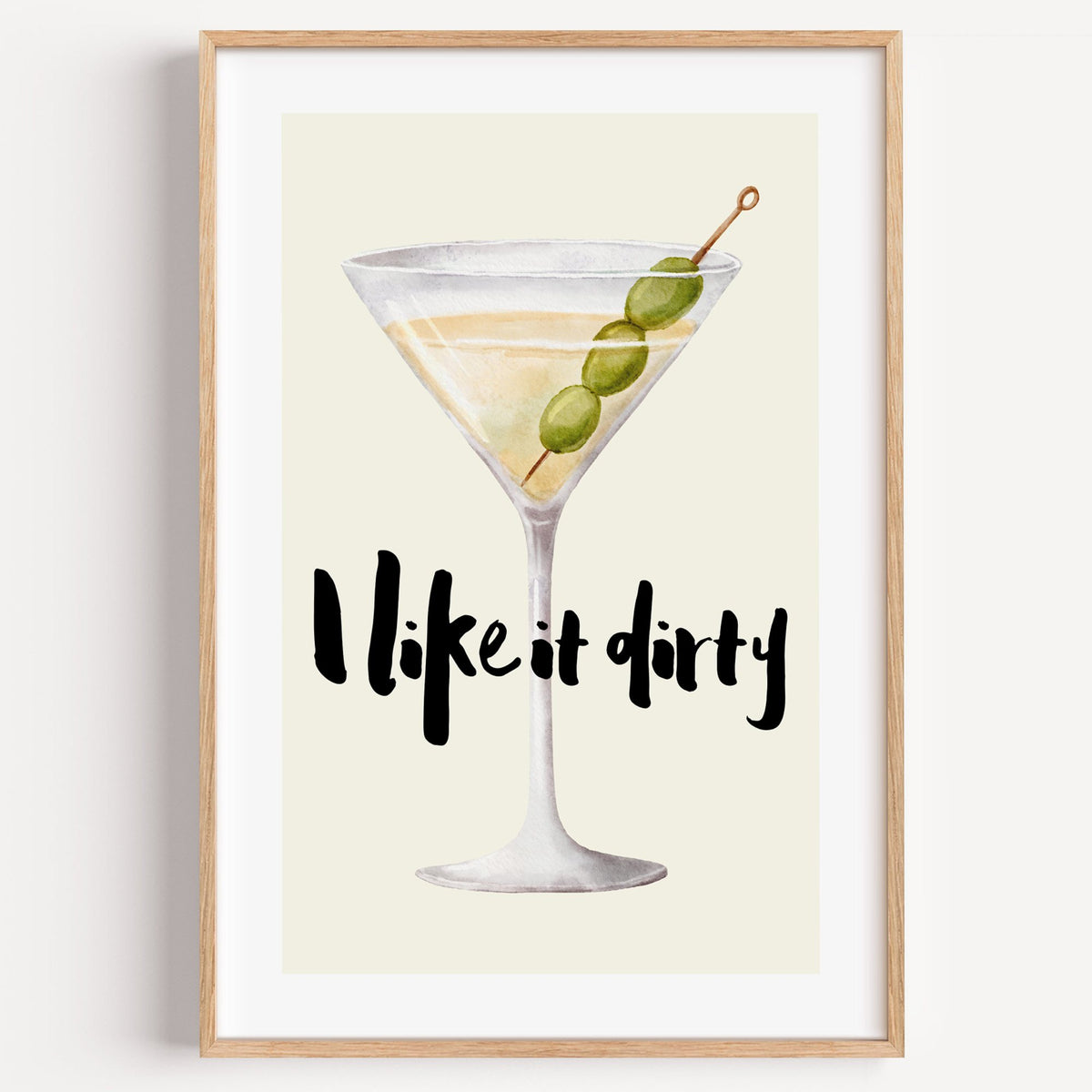 I like it dirty watercolor martini print in a light oak frame on a plain white wall