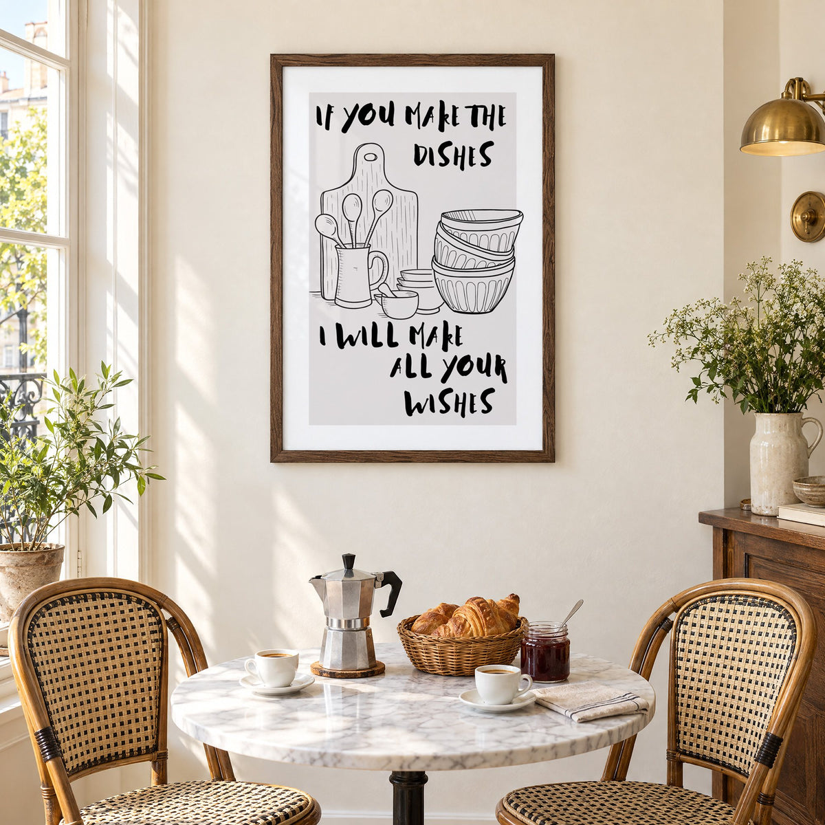 IF YOU MAKE THE DISHES kitchenware sketch print in a walnut frame above a marble bistro table with croissants and rattan chairs