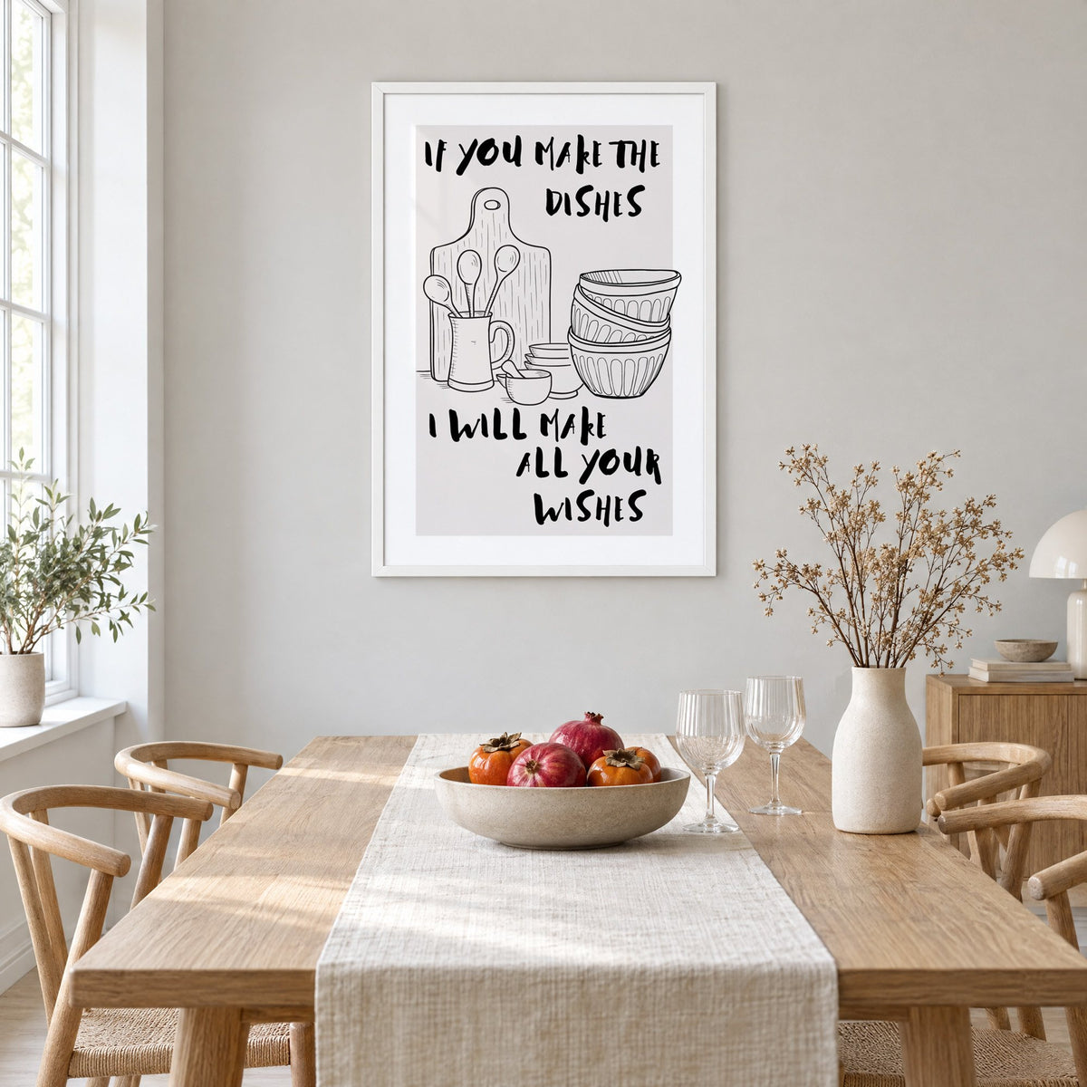 IF YOU MAKE THE DISHES kitchenware sketch print in a white frame above a light oak dining table with a linen runner and fruit bowl