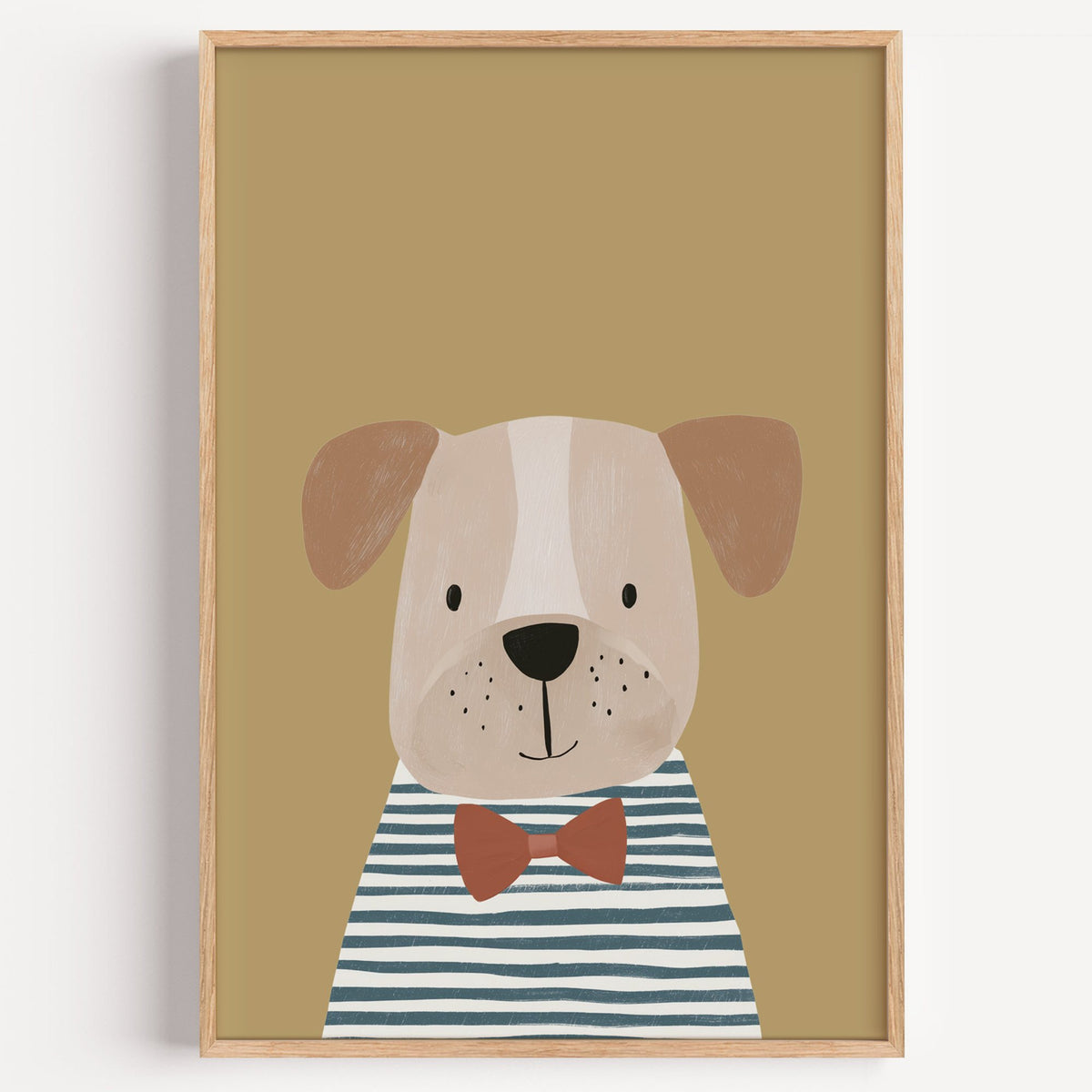 Dog in bow tie portrait nursery print in a light oak frame on a plain white wall