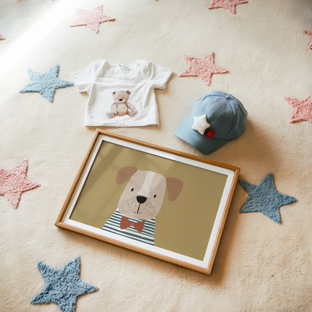 Landscape dog in bow tie portrait nursery print in a matted oak frame on a star rug with a baby tee