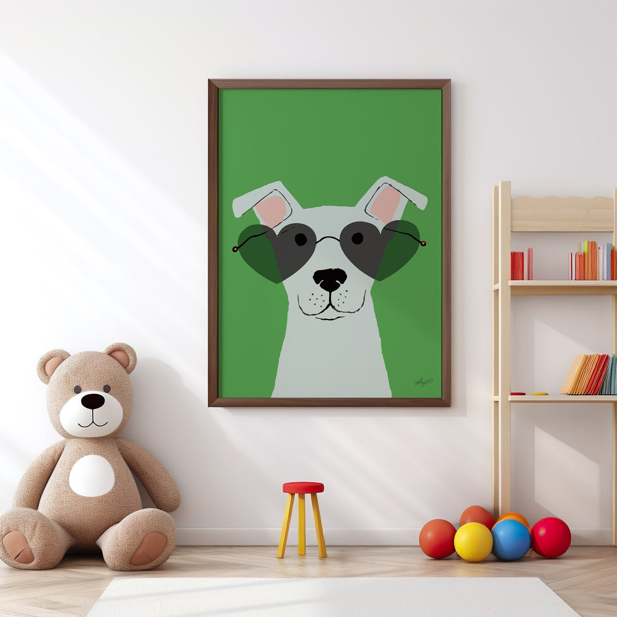 White dog in heart sunglasses nursery print in a walnut frame above a big teddy bear by a bookshelf