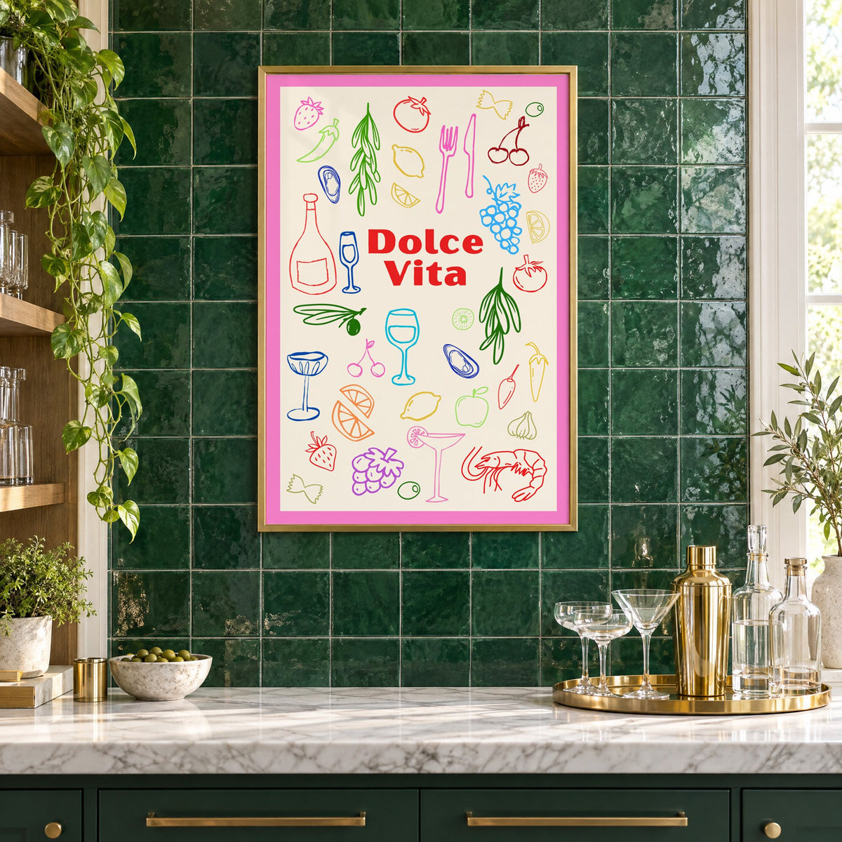 Dolce Vita colorful food doodle print in a brass frame on emerald green tiles above a home bar with coupe glasses