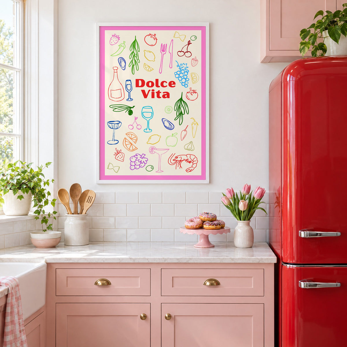 Dolce Vita colorful food doodle print in a white frame in a pink kitchen beside a red retro fridge