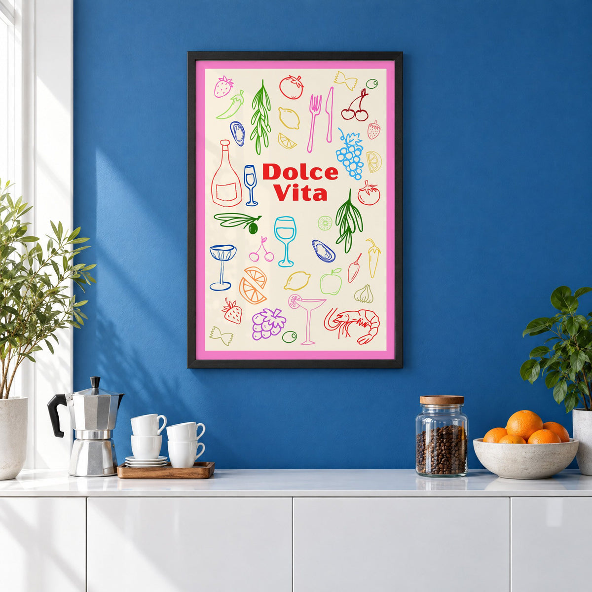 Dolce Vita colorful food doodle print in a black frame on a cobalt blue wall above a coffee station