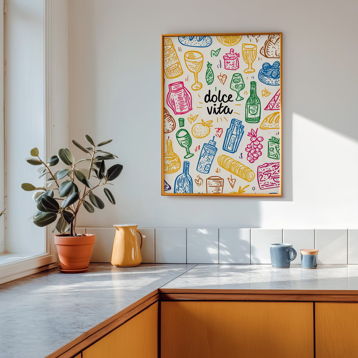 Dolce Vita doodle print shown in a gold frame above a marble counter in a tan kitchen