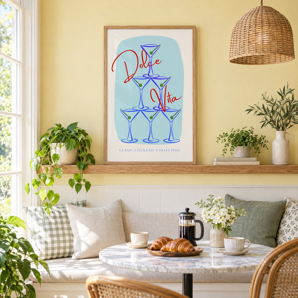 Dolce Vita martini tower print in an oak frame on a picture ledge above a sunny breakfast nook