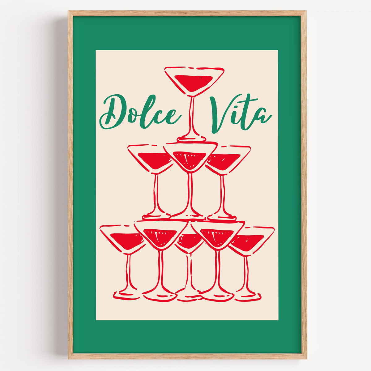 Dolce Vita red martini tower print in a light oak frame on a plain white wall