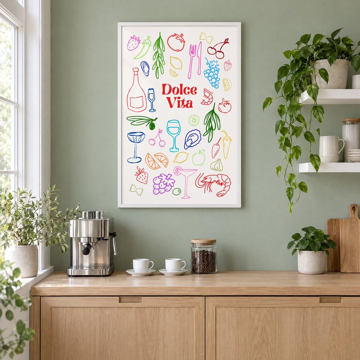 Dolce Vita rainbow doodle print in a white frame on a sage green coffee nook wall above an espresso machine