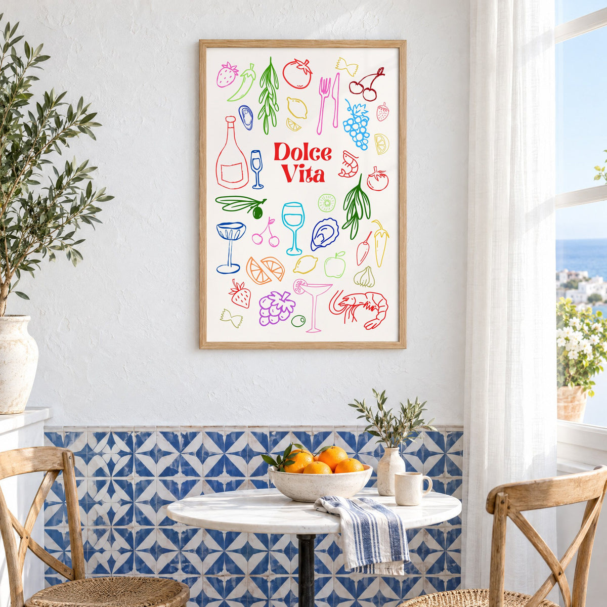 Dolce Vita rainbow doodle print in an oak frame above a bistro table and blue patterned tiles
