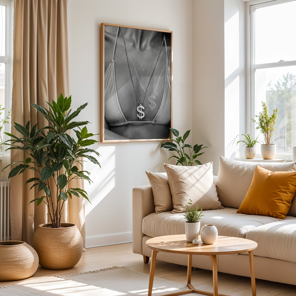 Dollar sign pendant and tan line close-up print in an oak frame above a cream sofa beside woven planters