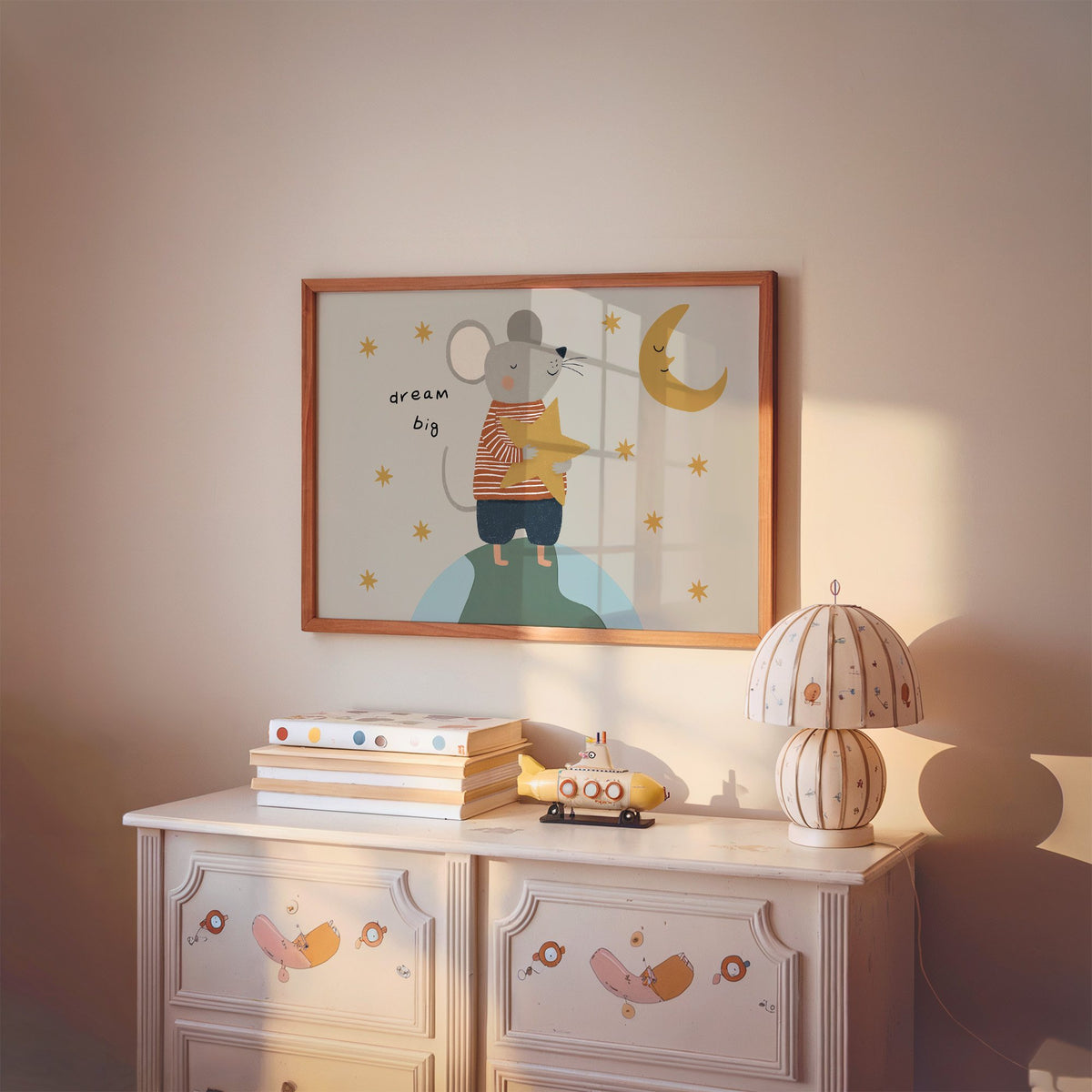 Landscape dream big mouse hugging star nursery print in a cherry wood frame above a painted dresser and lamp