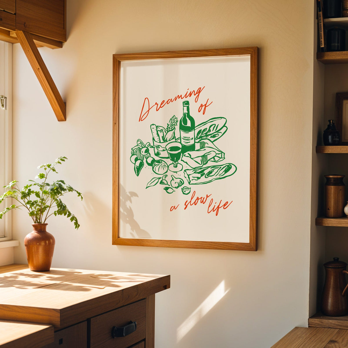 Dreaming of a Slow Life print in a walnut frame on a cream kitchen wall