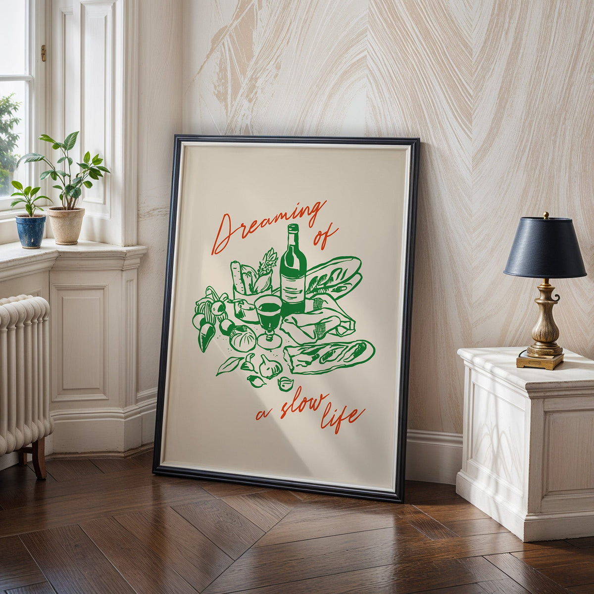 Dreaming of a Slow Life print in a black frame on a dark herringbone floor