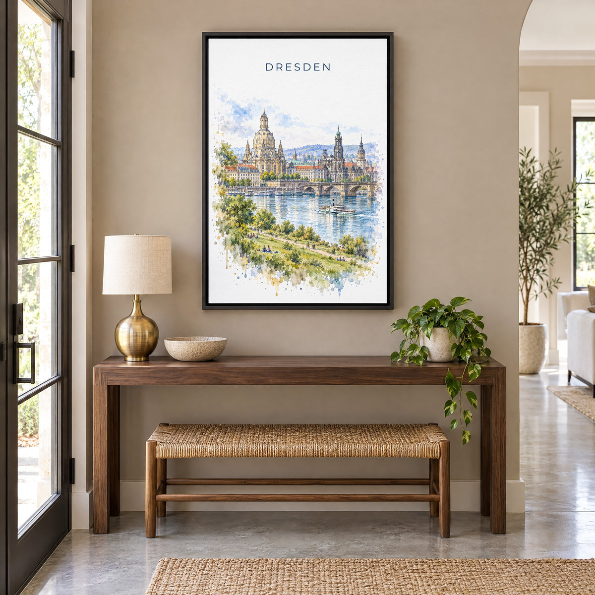 Dresden watercolor print as a black floater canvas above a walnut console and woven bench in an entryway