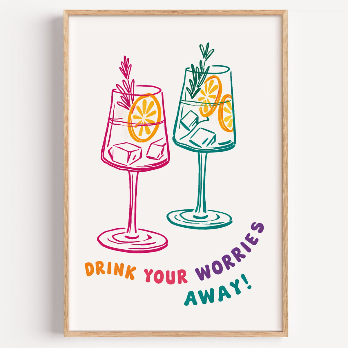 Drink Your Worries Away spritz print in a light oak frame on a plain white wall