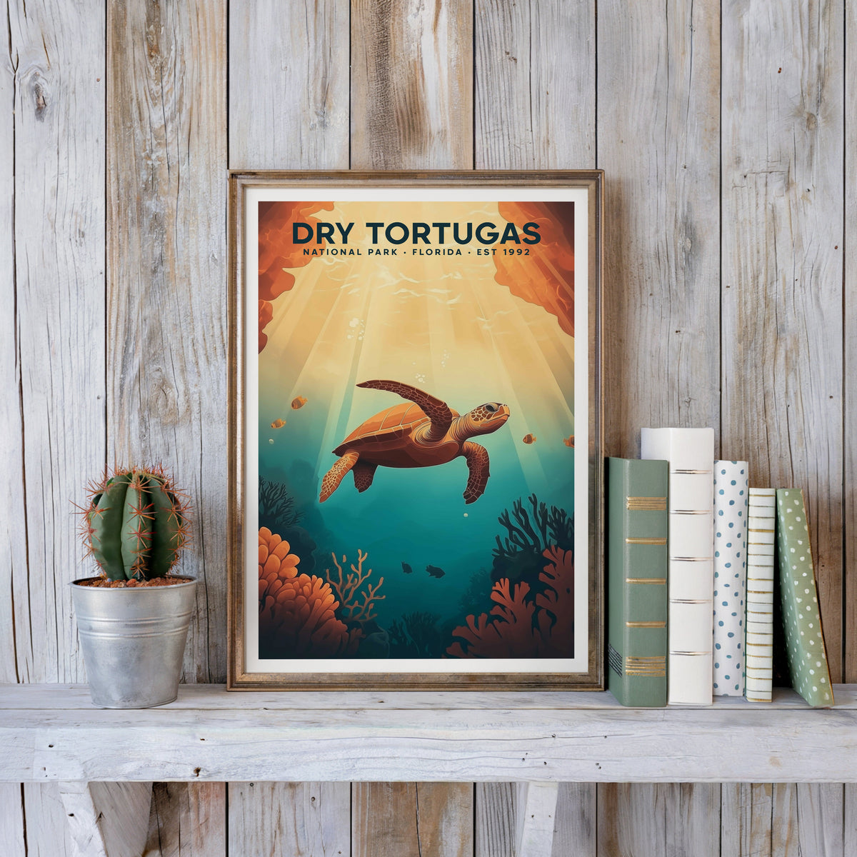 Dry Tortugas poster in an antique gold frame against whitewashed farmhouse planks and books