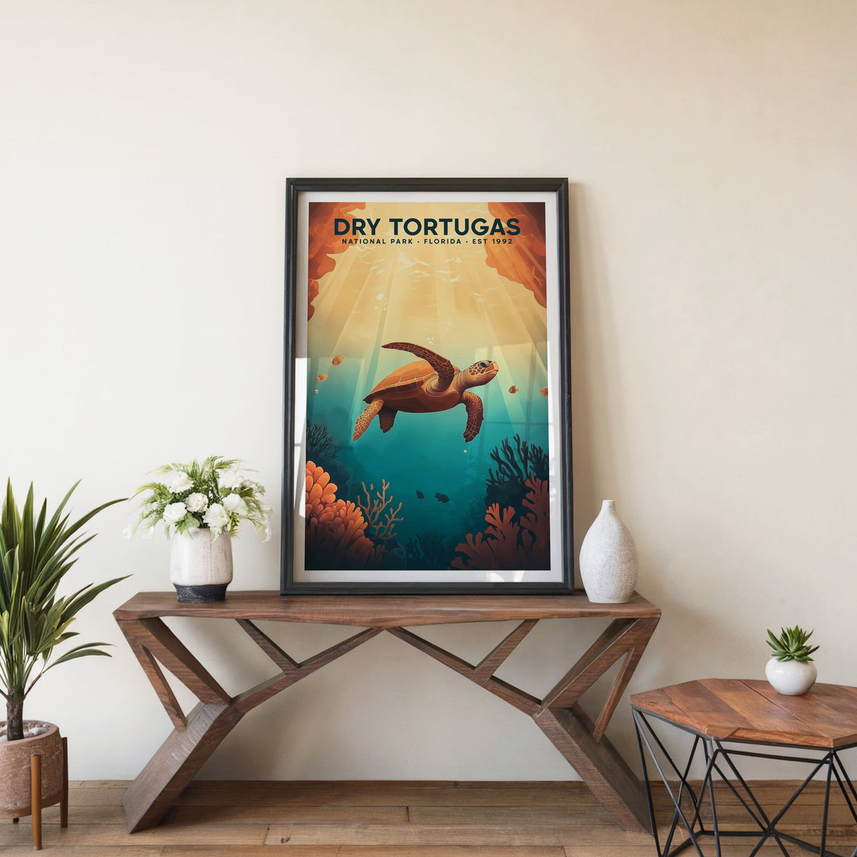Dry Tortugas poster in a black frame on an entryway console table with white flowers