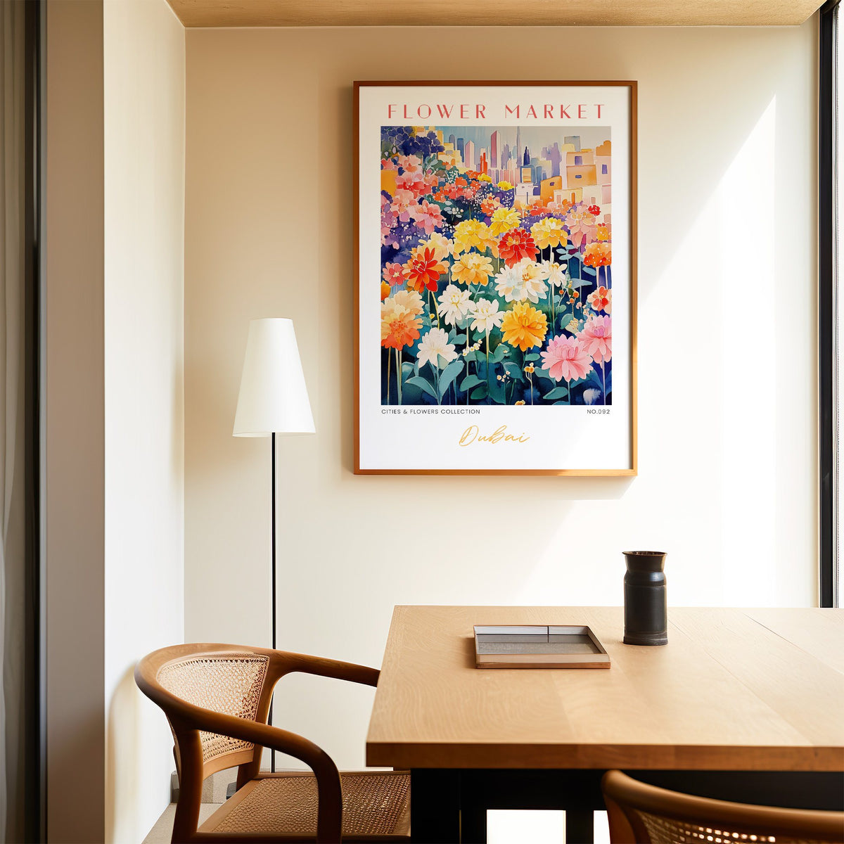 Dubai flower market print in an oak frame above a dining table and cane chair