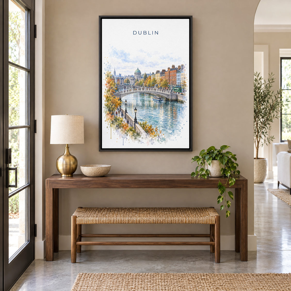 Dublin watercolor print as a black floater canvas above a walnut console and woven bench in an entryway