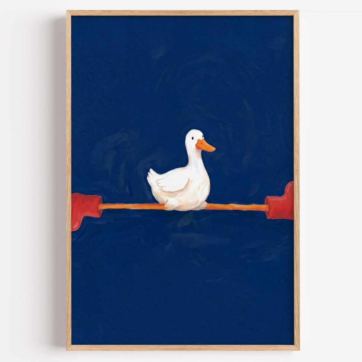 Duck doing the splits print in a light oak frame on a plain white wall