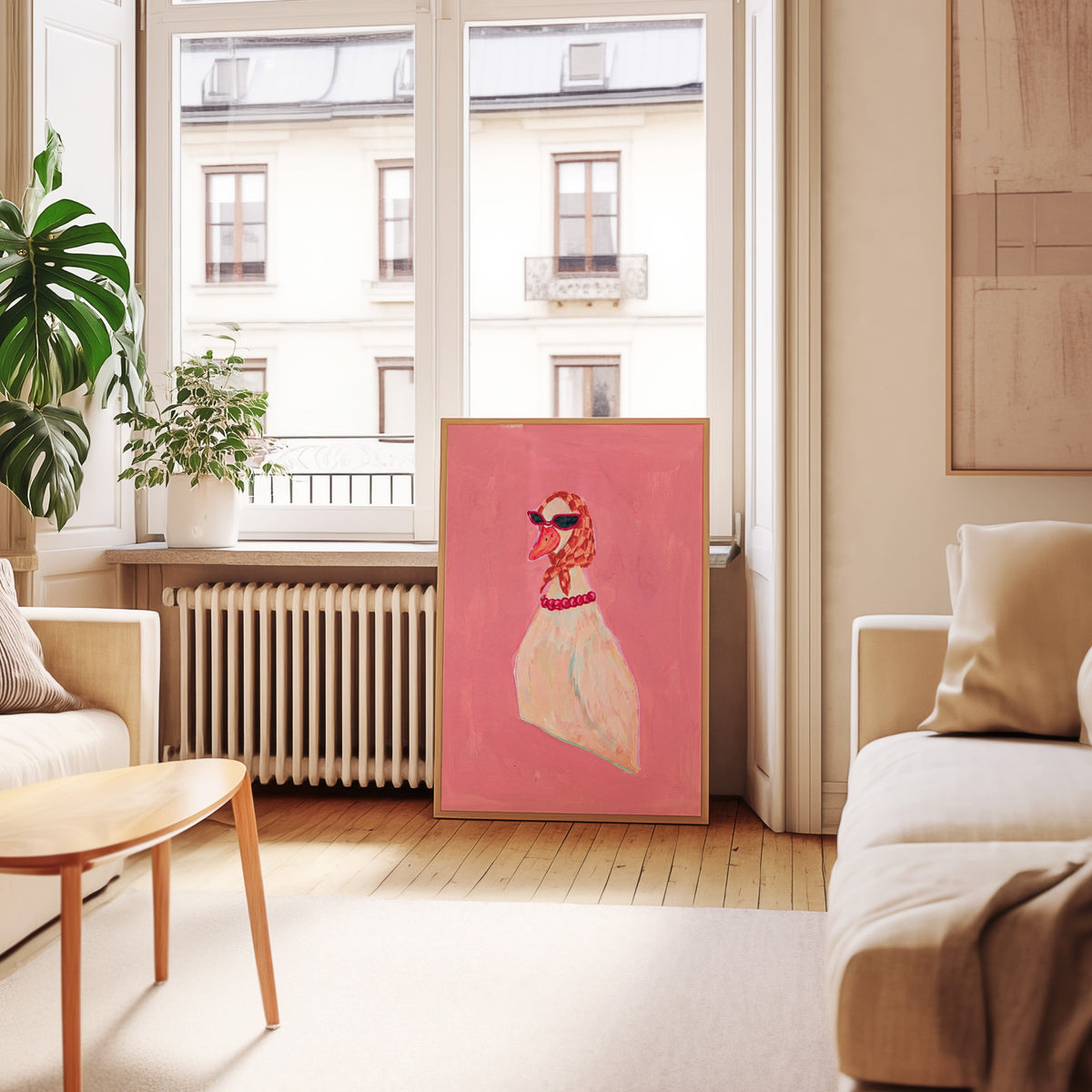 Retro chic duck print in an oak frame leaning below tall French windows