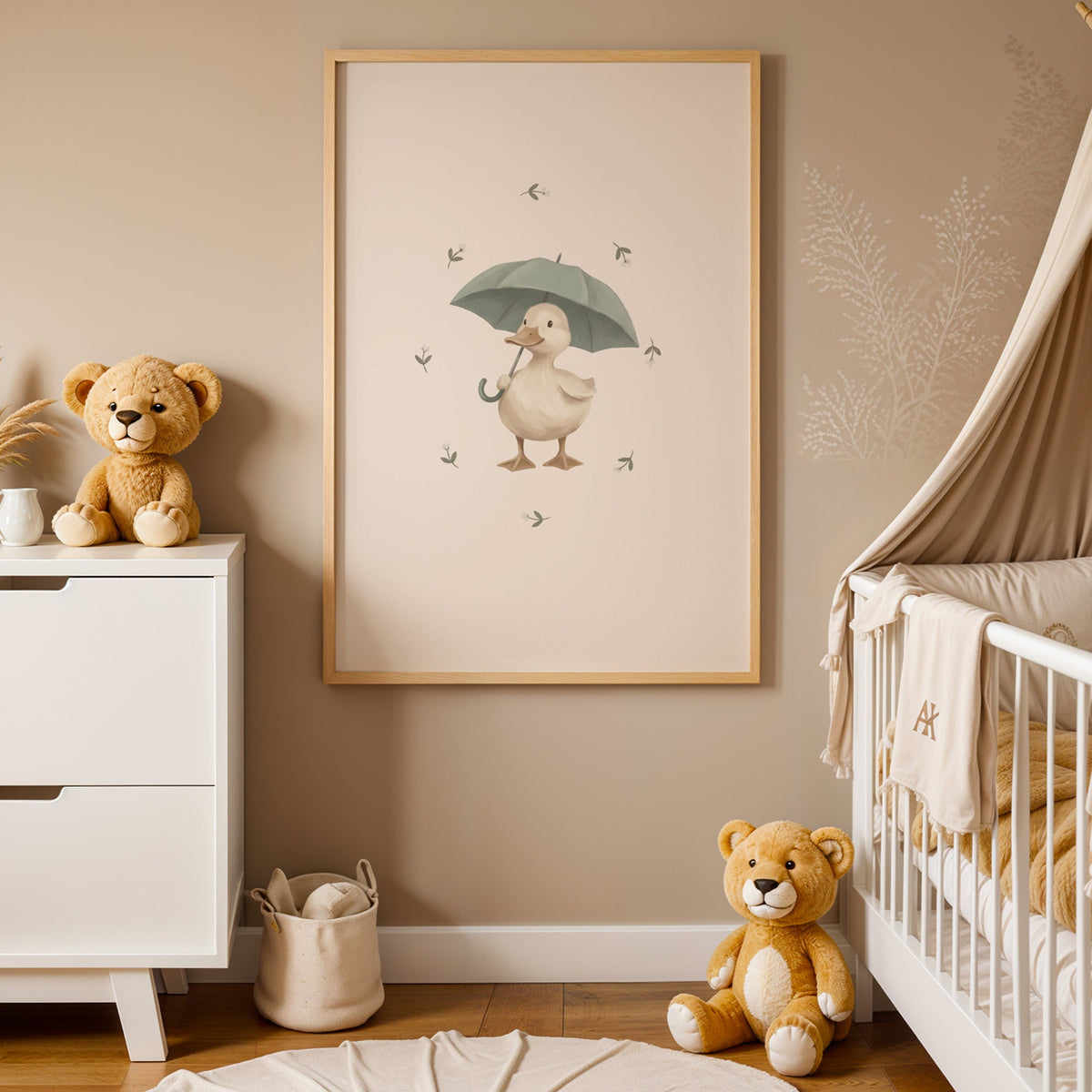 Cream duck holding a sage umbrella nursery print in an oak frame between a white dresser and a canopy crib