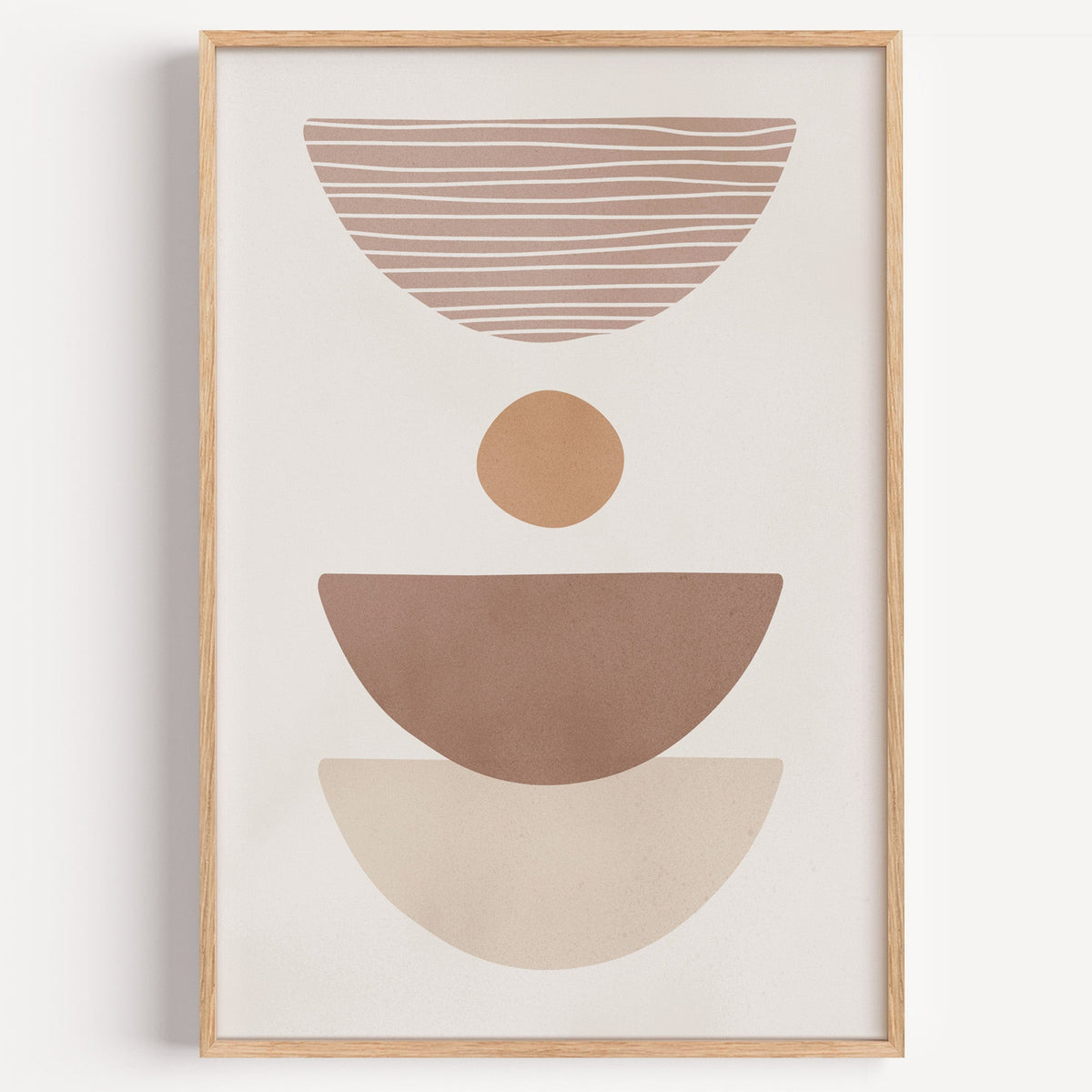 Dusty rose striped bowl shapes boho print in a light oak frame on a plain white wall