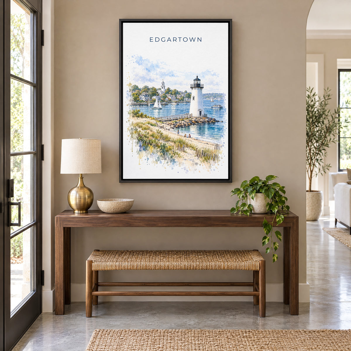 Edgartown watercolor print as a black floater canvas above a walnut console and woven bench in an entryway