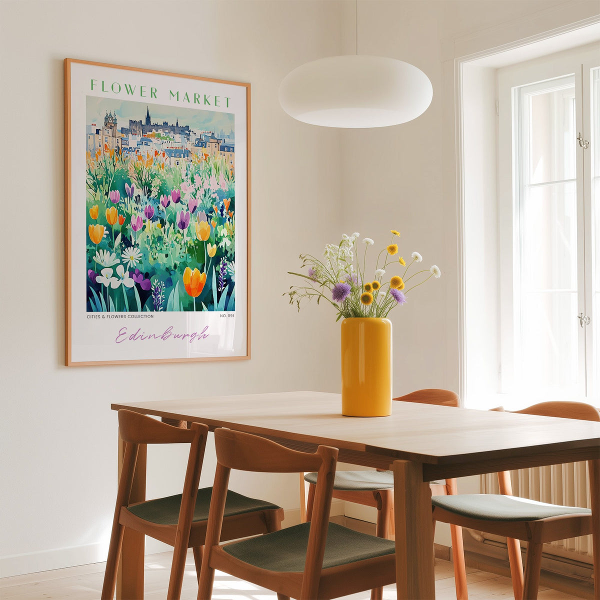 Edinburgh flower market print in an oak frame above a dining table with a yellow vase and white pendant light