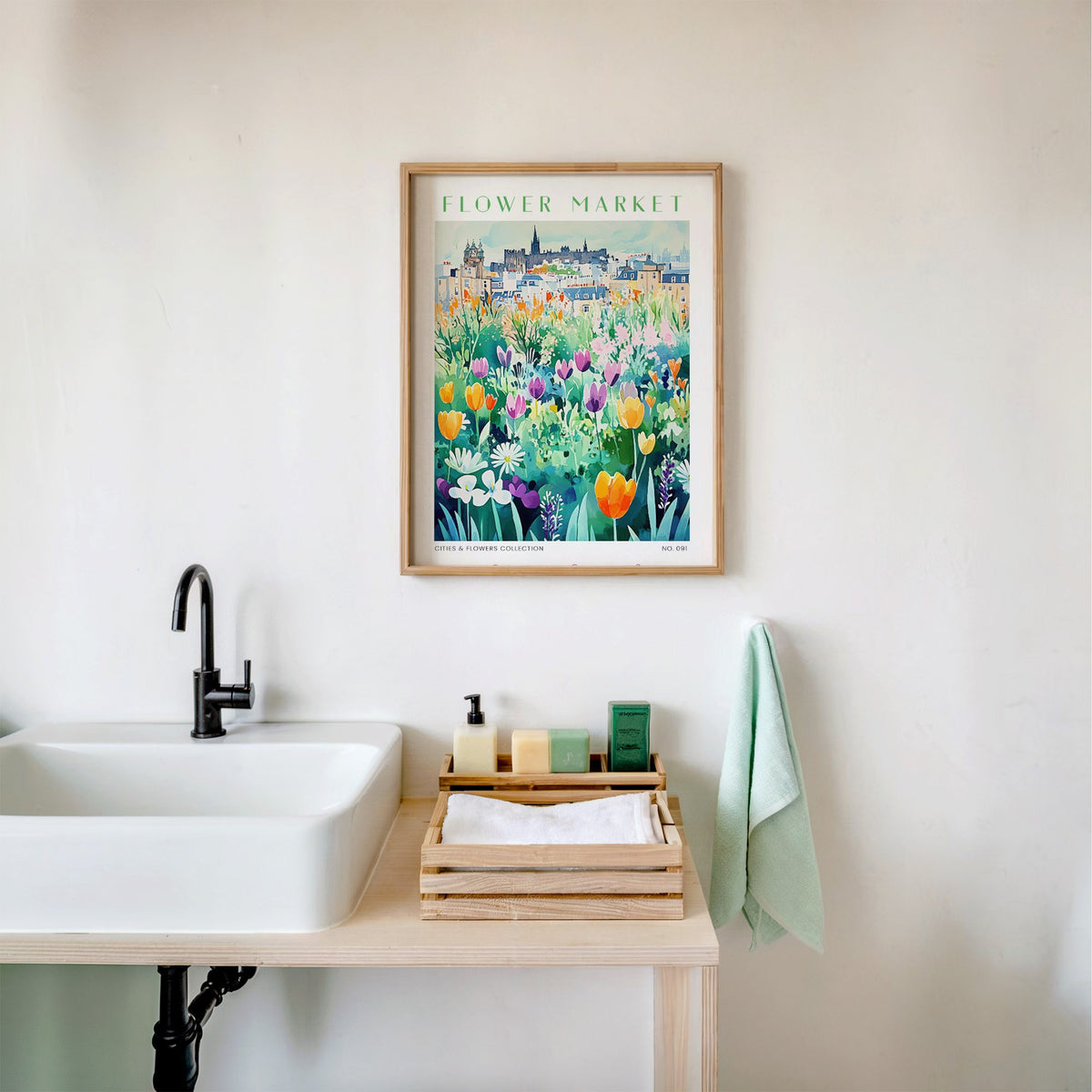 Edinburgh flower market print in an oak frame above a white bathroom sink with folded towels
