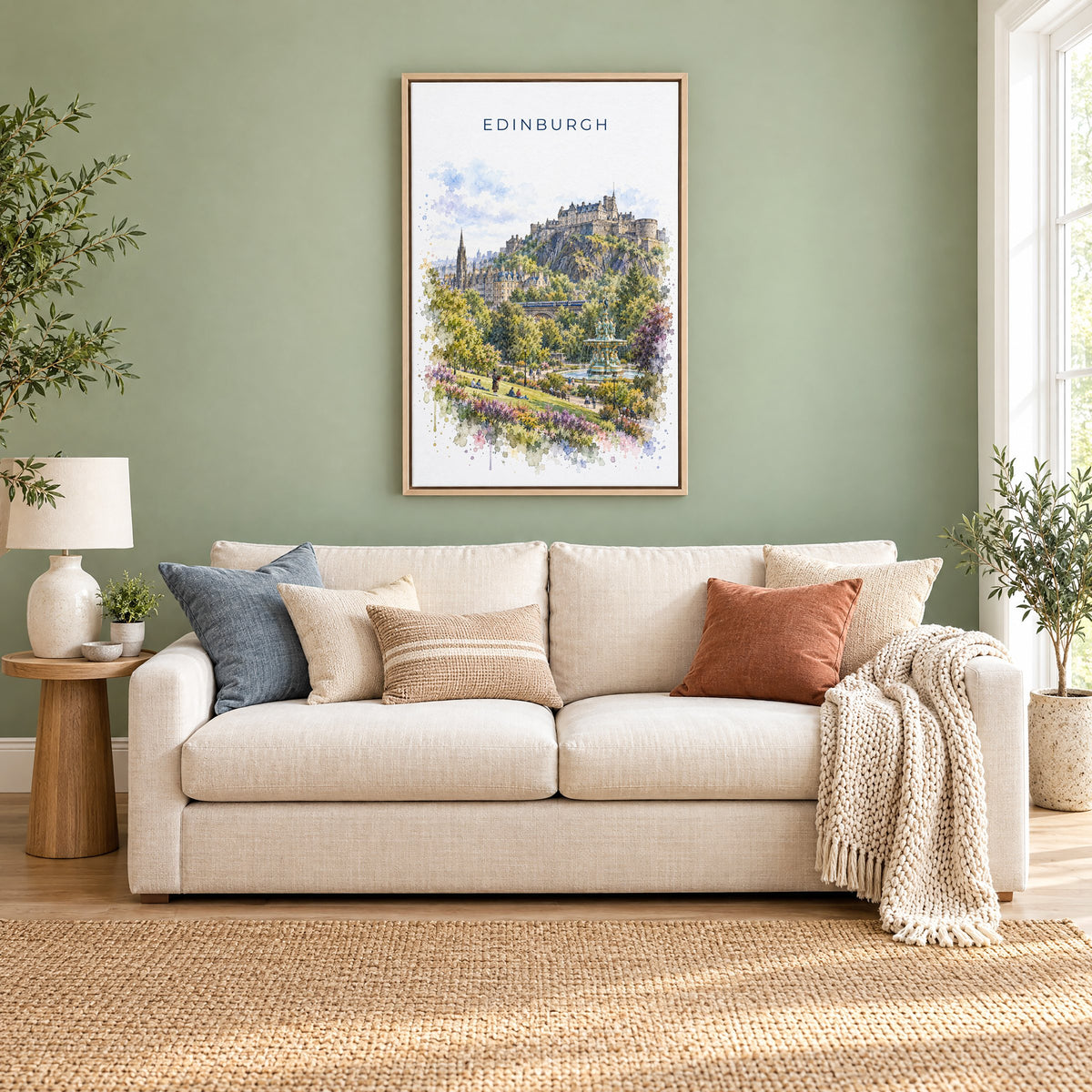Edinburgh watercolor print as a natural floater canvas above a cream linen sofa on a sage green wall