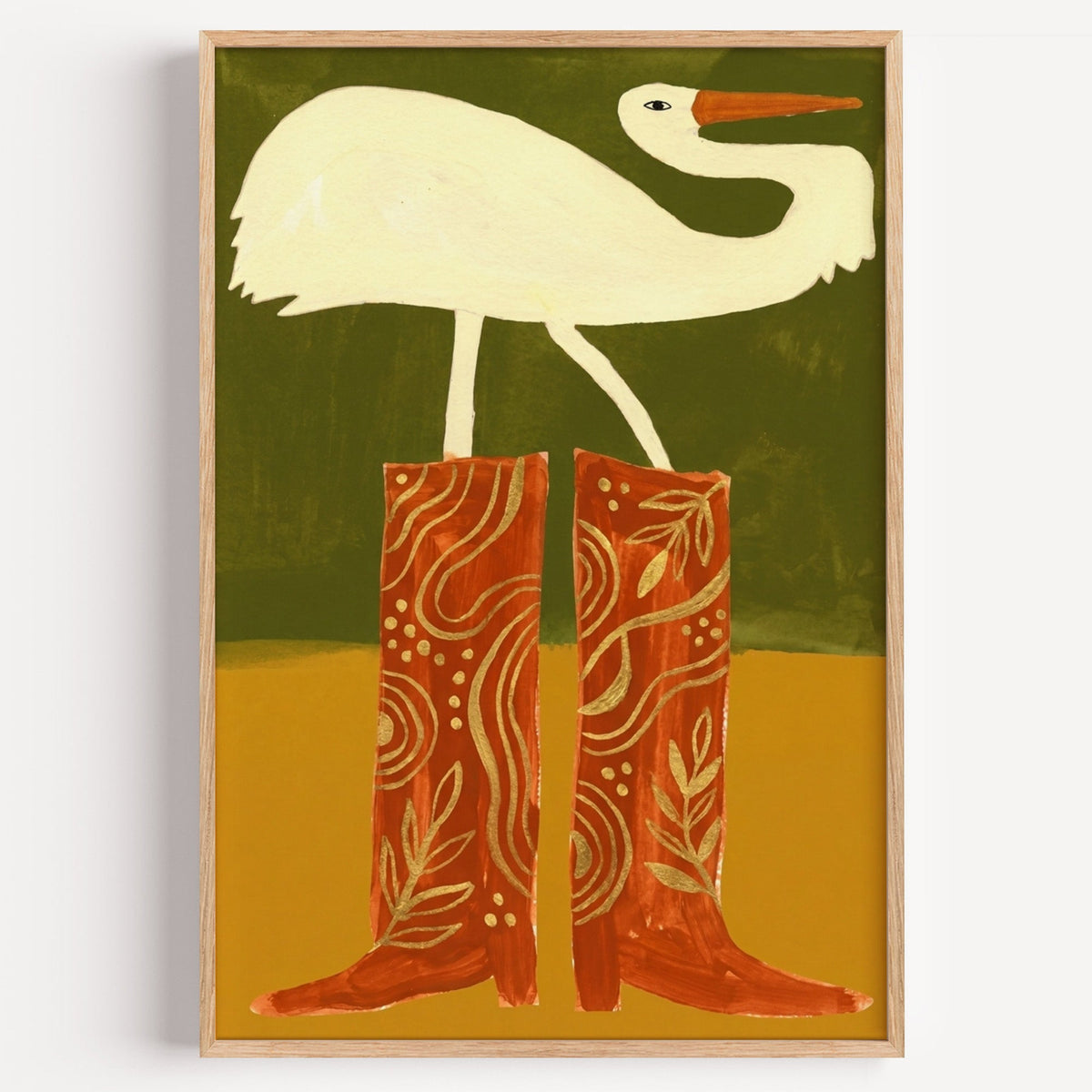 Egret in cowboy boots print in a light oak frame on a plain white wall