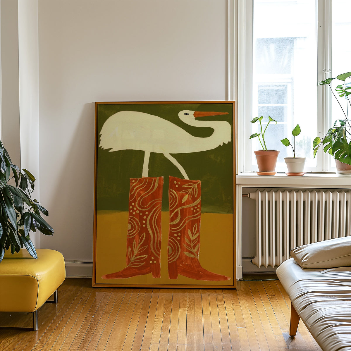 Olive and mustard bird print in an oak frame leaning beside a yellow leather bench