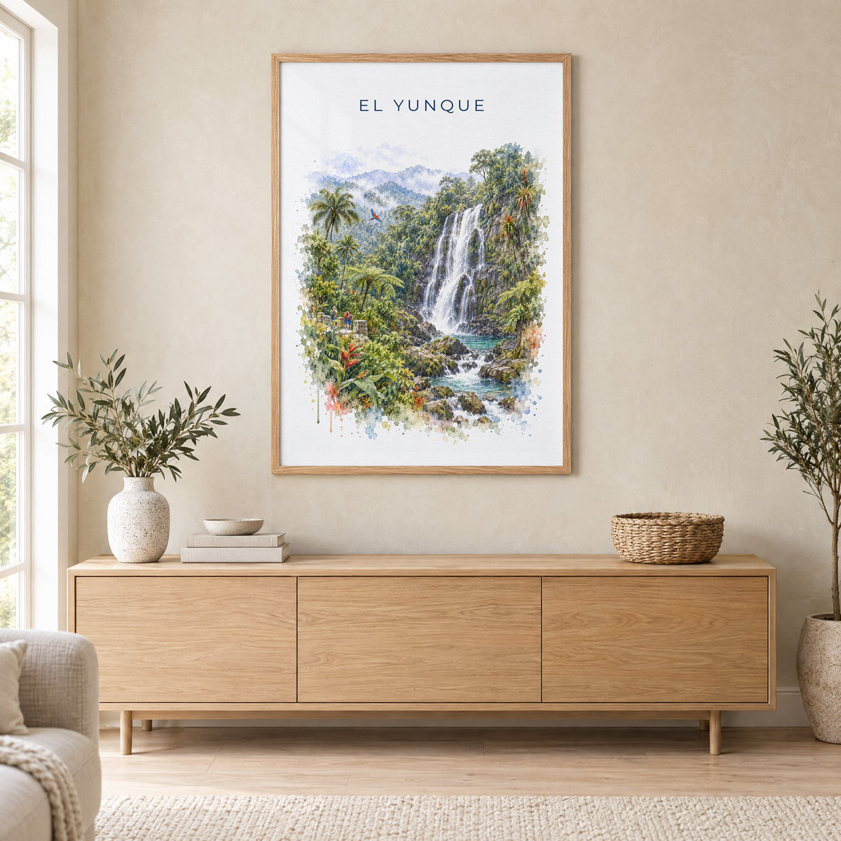 El Yunque watercolor print in an oak frame above a light wood sideboard in a Scandinavian living room