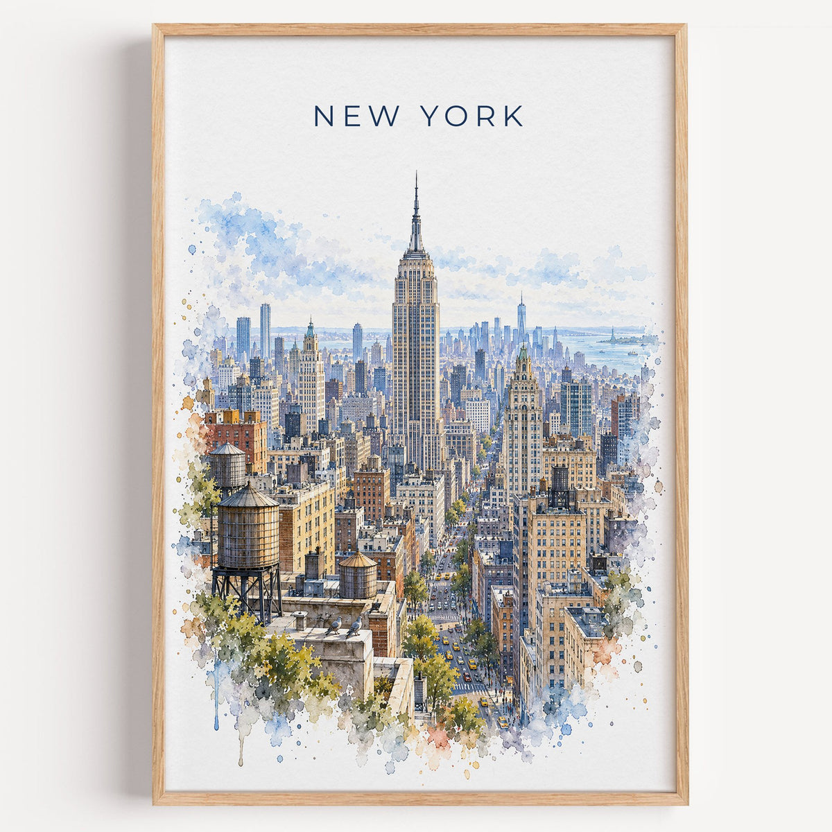 Empire State Building watercolor print in a light oak frame on a plain white wall