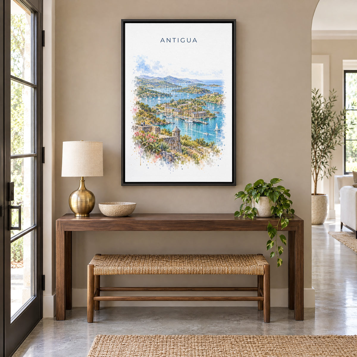Antigua watercolor print as a black floater canvas above a walnut console and woven bench in an entryway