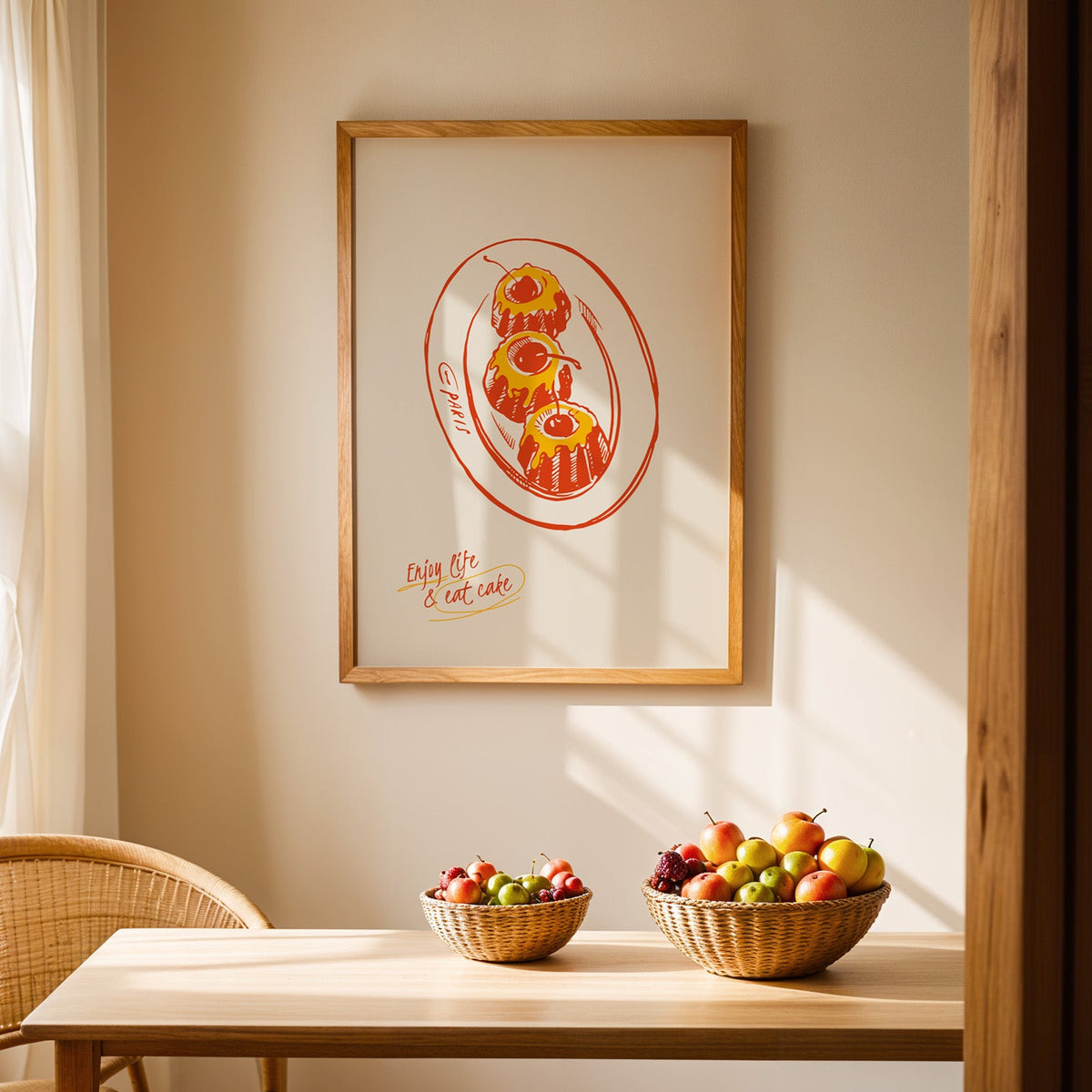 Enjoy Life and Eat Cake print in an oak frame above a dining table with rattan chairs