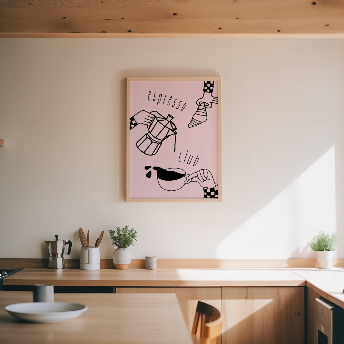 Espresso Club print in an oak frame above a wood counter with a moka pot and herbs