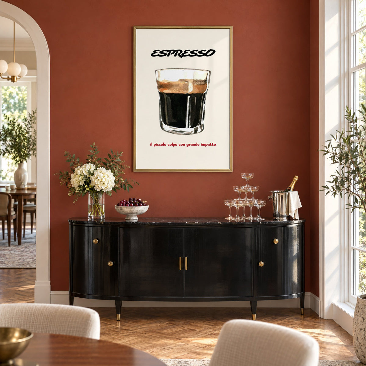 ESPRESSO watercolor glass print in a brass frame on a terracotta wall above a black buffet with a champagne tower