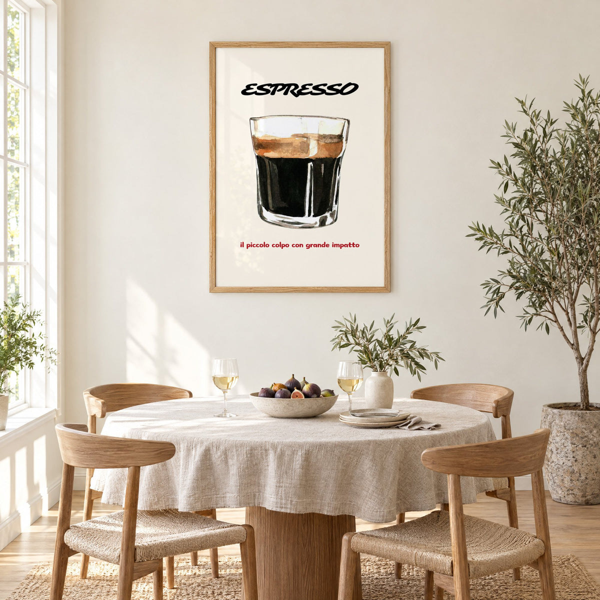 ESPRESSO watercolor glass print in an oak frame above a round linen-covered dining table with figs and wine