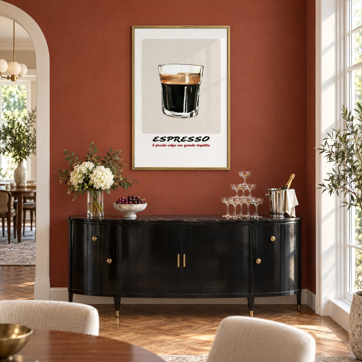 ESPRESSO watercolor glass print in a brass frame on a terracotta wall above a black buffet with a champagne tower