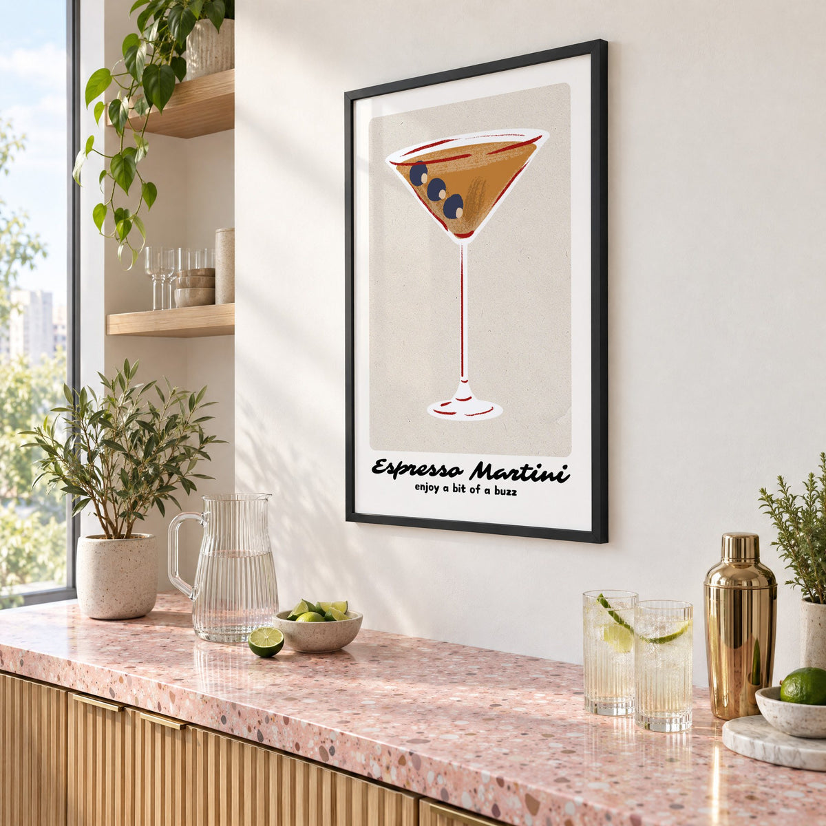Espresso Martini cocktail glass print in a black frame above a pink terrazzo cocktail counter with limes, seen at an angle