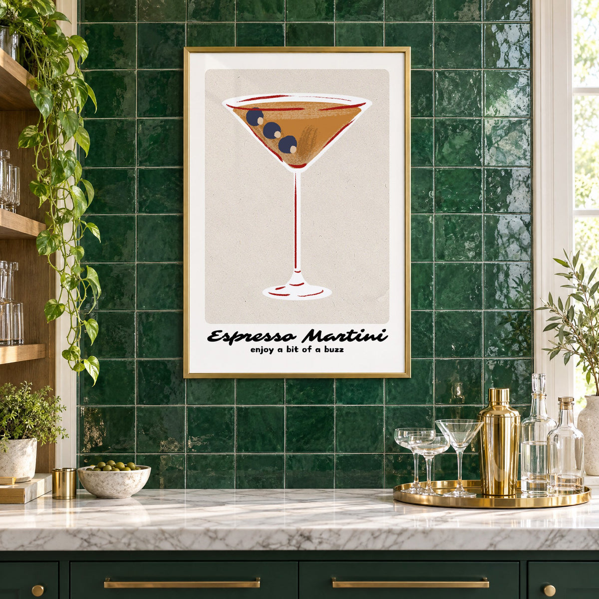 Espresso Martini cocktail glass print in a brass frame on emerald green tiles above a home bar with coupe glasses