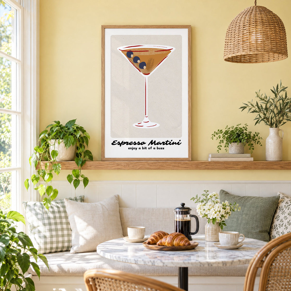 Espresso Martini cocktail glass print in an oak frame on a picture ledge above a sunny breakfast nook