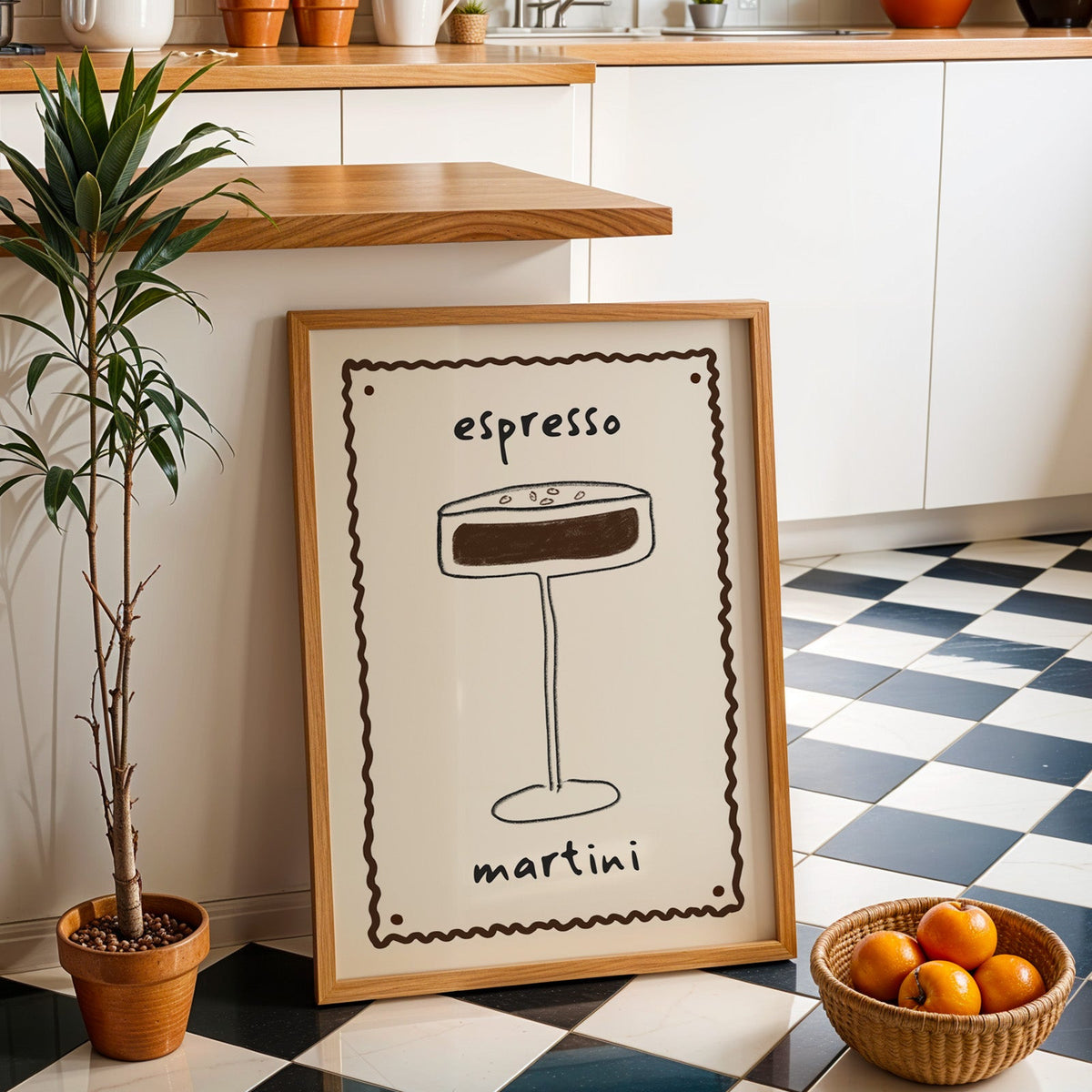 Espresso martini pencil line print in an oak frame by a kitchen island and checkered floor