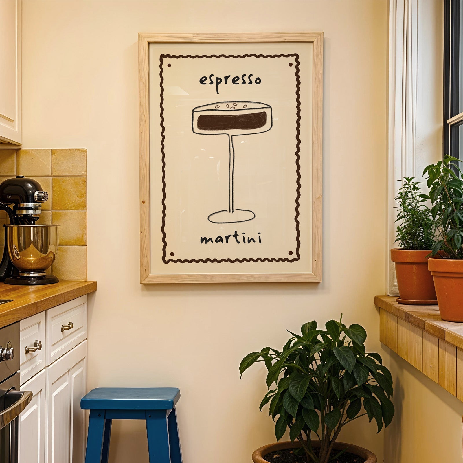 Espresso martini pencil line print in a wood frame on a yellow tiled kitchen wall