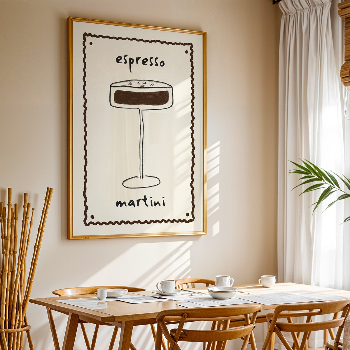 Espresso martini pencil line print in a gold frame above a sunlit breakfast table