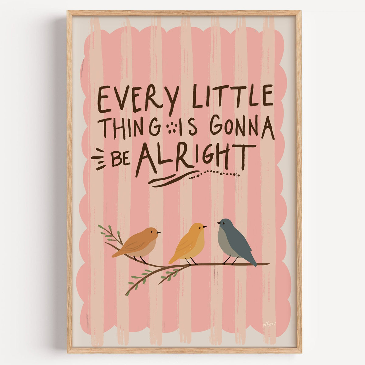Every little thing birds quote nursery print in a light oak frame on a plain white wall