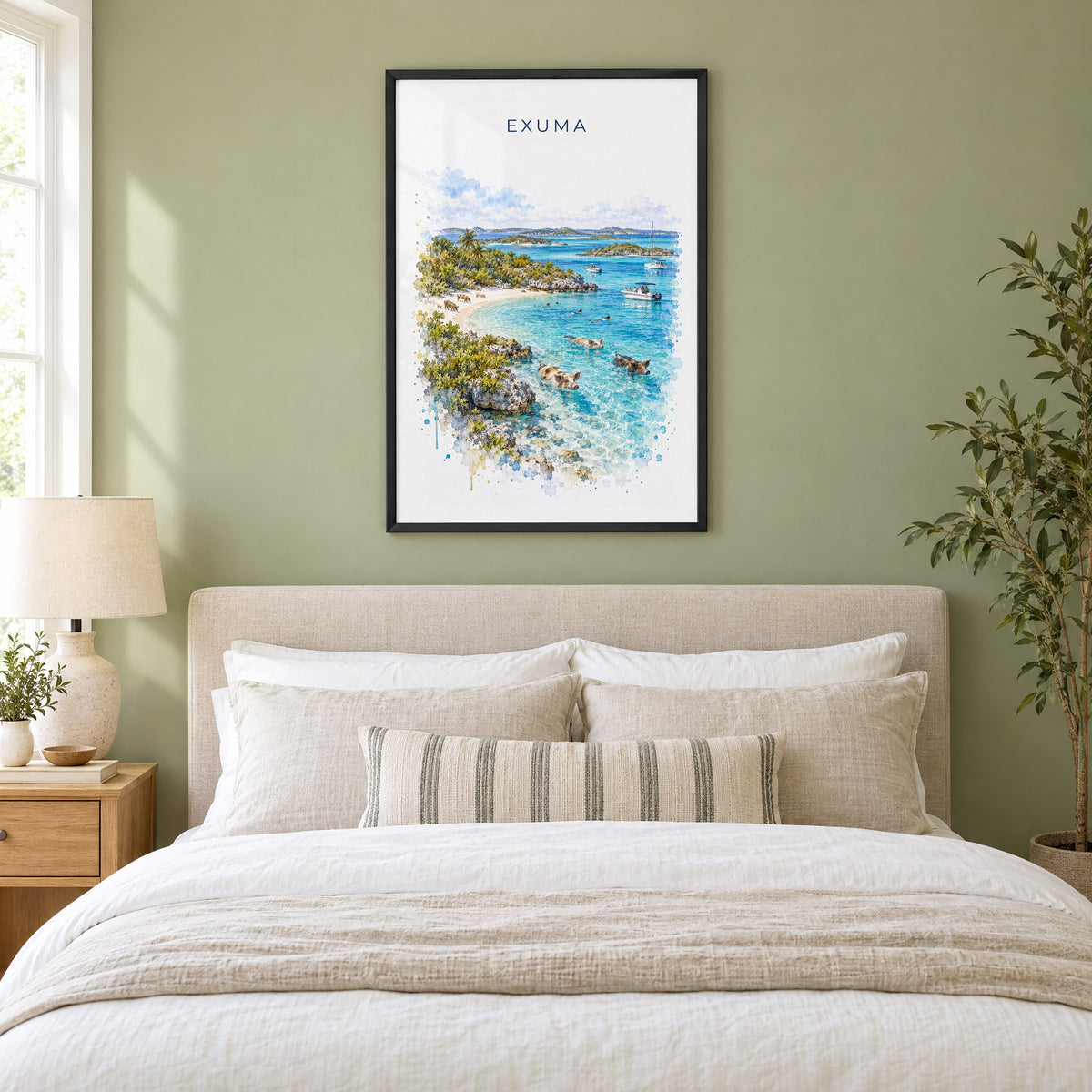 Exuma watercolor print in a black frame above an upholstered headboard in a sage green bedroom